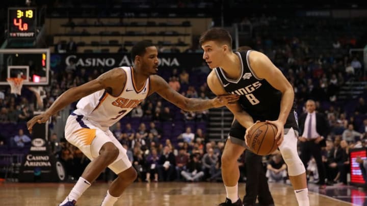 PHOENIX, ARIZONA - DECEMBER 04: Bogdan Bogdanovic #8 of the Sacramento Kings handles the ball guarded by Trevor Ariza #3 of the Phoenix Suns during the first half of the NBA game at Talking Stick Resort Arena on December 4, 2018 in Phoenix, Arizona. NOTE TO USER: User expressly acknowledges and agrees that, by downloading and or using this photograph, User is consenting to the terms and conditions of the Getty Images License Agreement. (Photo by Christian Petersen/Getty Images)