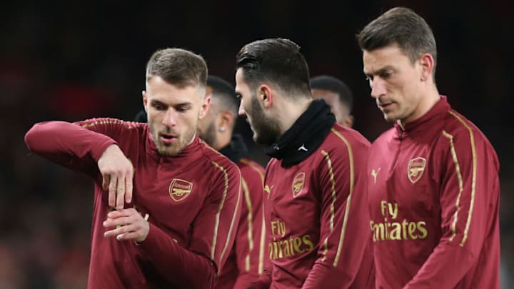 LONDON, ENGLAND - MARCH 14: Aaron Ramsey and Sead Kolasinac of Arsenal in discussion as they warm up prior to the UEFA Europa League Round of 16 Second Leg match between Arsenal and Stade Rennais at Emirates Stadium on March 14, 2019 in London, England. (Photo by Alex Morton/Getty Images)