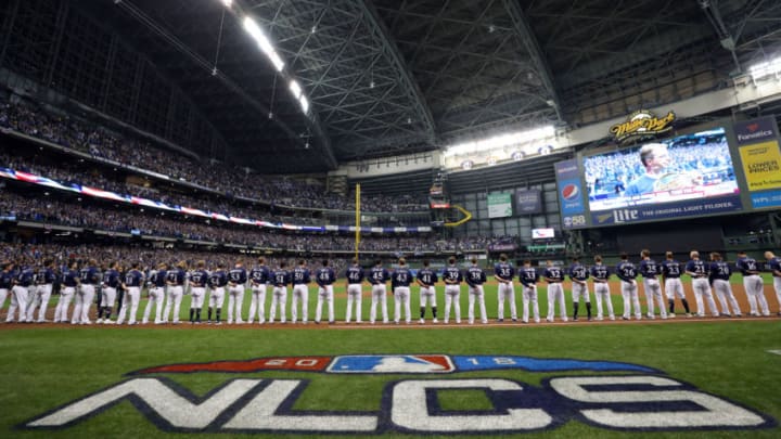 MILWAUKEE, WI - OCTOBER 12: Milwaukee Brewers players are seen during the national anthem before Game 1 of the NLCS against the Los Angeles Dodgers at Miller Park on Friday, October 12, 2018 in Milwaukee, Wisconsin. (Photo by Alex Trautwig/MLB Photos via Getty Images)