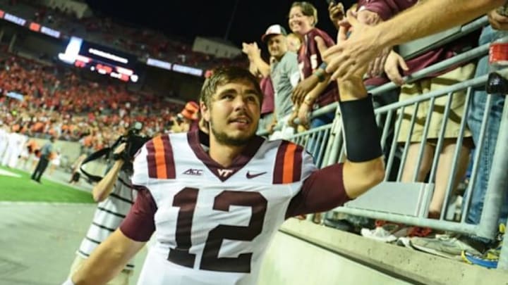 Sep 6, 2014; Columbus, OH, USA; Virginia Tech Hokies quarterback Michael Brewer (12) celebrates after defeating the Ohio State Buckeyes 35-21at Ohio Stadium. Mandatory Credit: Andrew Weber-USA TODAY Sports Sep 6, 2014; Columbus, OH, USA; Virginia Tech Hokies quarterback Michael Brewer (12) celebrates after defeating the Ohio State Buckeyes 35-21at Ohio Stadium. Mandatory Credit: Andrew Weber-USA TODAY Sports
