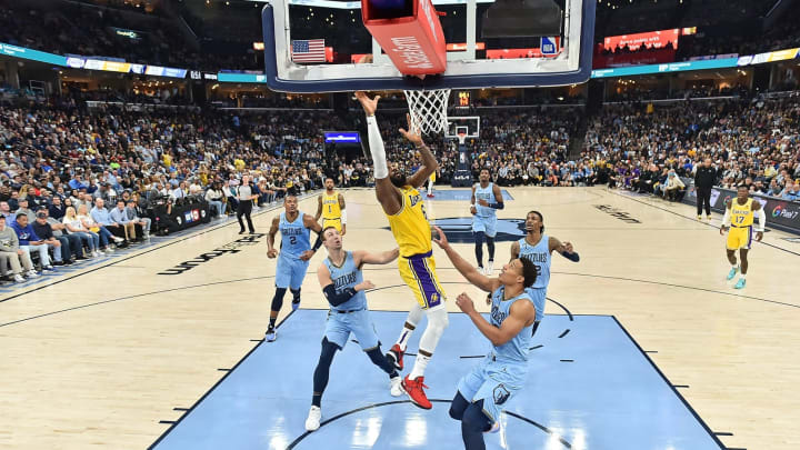 LeBron James of the Los Angeles Lakers goes to the basket against Desmond Bane of the Memphis Grizzlies. (Photo by Justin Ford/Getty Images)