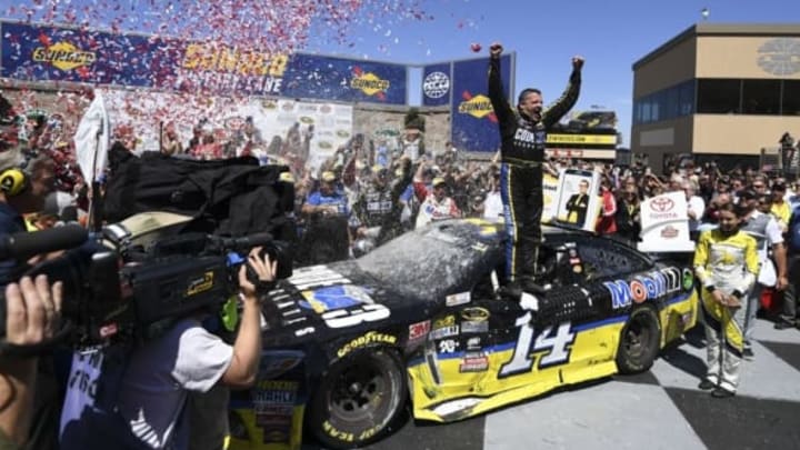 June 26, 2016; Sonoma, CA, USA; Sprint Cup Series driver Tony Stewart (14) celebrates in victory lane during the Toyota Save Mart 350 at Sonoma Raceway. Mandatory Credit: Kyle Terada-USA TODAY Sports