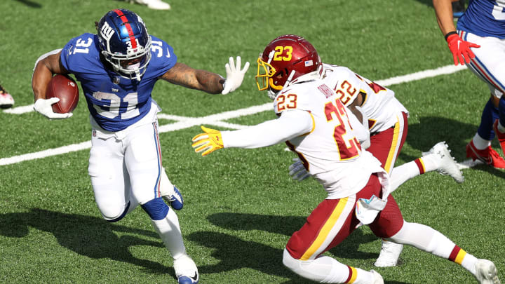 EAST RUTHERFORD, NEW JERSEY – OCTOBER 18: Devonta Freeman #31 of the New York Giants rushes with the ball against the Washington Football Team during their NFL game at MetLife Stadium on October 18, 2020 in East Rutherford, New Jersey. (Photo by Al Bello/Getty Images)