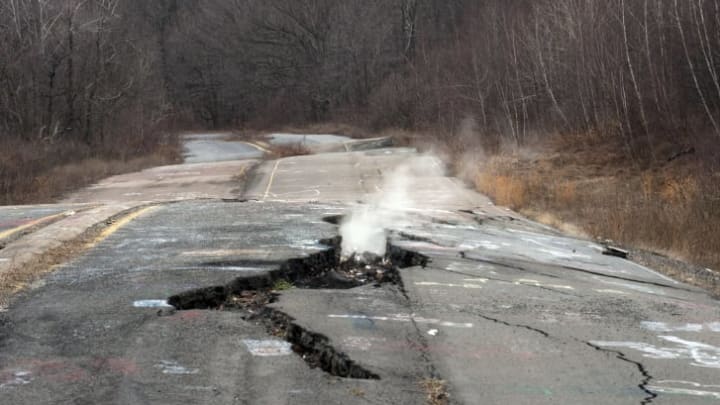 Smoke coming up from cracked concrete in Centralia, Pennsylvania.