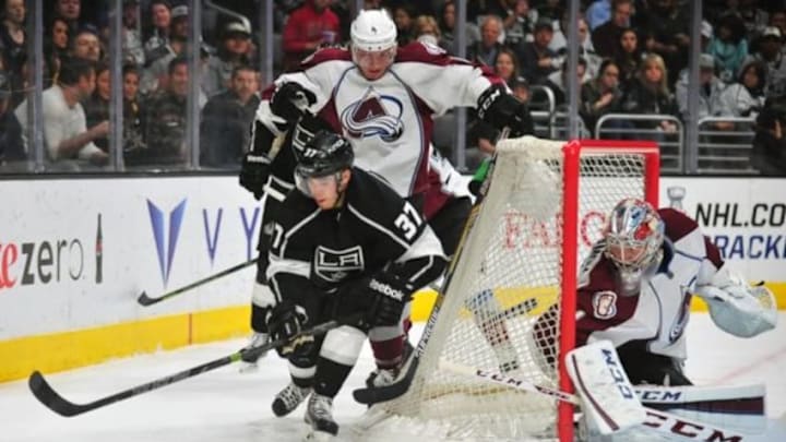 April 4, 2015; Los Angeles, CA, USA; Colorado Avalanche goalie Semyon Varlamov (1) and defenseman Tyson Barrie (4) defend the goal against Los Angeles Kings center Nick Shore (37) during the second period at Staples Center. Mandatory Credit: Gary A. Vasquez-USA TODAY Sports