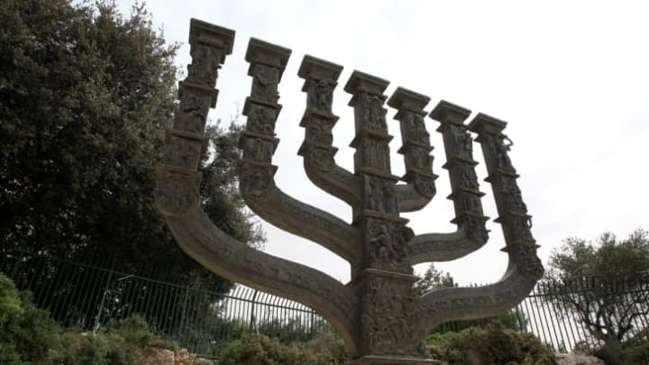 A stone menorah outside the knesset.