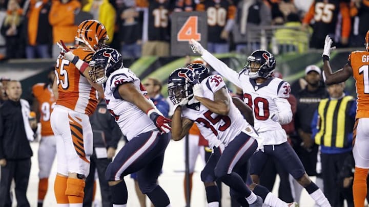 Nov 16, 2015; Cincinnati, OH, USA; Houston Texans defensive tackle Christian Covington (95) safety Lonnie Ballentine (39) and cornerback Kevin Johnson (30) celebrate against the Cincinnati Bengals in the second half at Paul Brown Stadium. Houston defeated Cincinnati 10-6. Mandatory Credit: Mark Zerof-USA TODAY Sports