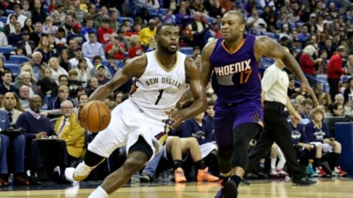 Dec 30, 2014; New Orleans, LA, USA; New Orleans Pelicans forward Tyreke Evans (1) drives past Phoenix Suns forward P.J. Tucker (17) during the first quarter of a game at Smoothie King Center. Mandatory Credit: Derick E. Hingle-USA TODAY Sports