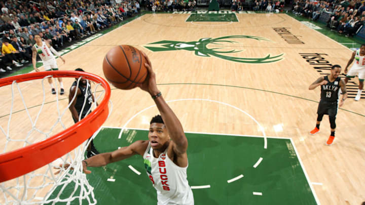 MILWAUKEE, WI - DECEMBER 29: Giannis Antetokounmpo #34 of the Milwaukee Bucks dunks the ball against the Brooklyn Nets on December 29, 2018 at the Fiserv Forum in Milwaukee, Wisconsin. NOTE TO USER: User expressly acknowledges and agrees that, by downloading and/or using this photograph, user is consenting to the terms and conditions of the Getty Images License Agreement. Mandatory Copyright Notice: Copyright 2018 NBAE (Photo by Gary Dineen/NBAE via Getty Images)