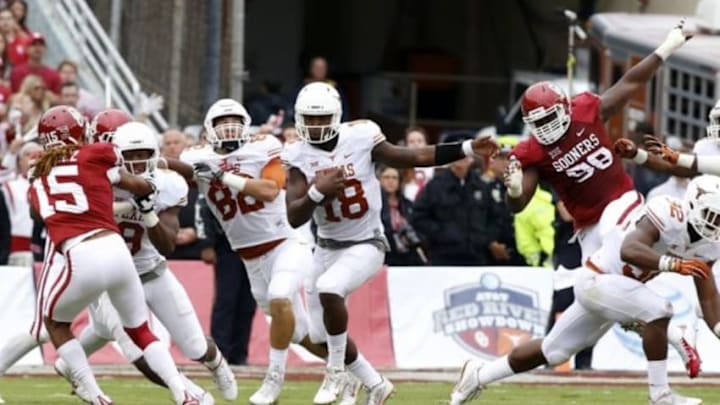 Oct 11, 2014; Dallas, TX, USA;Texas Longhorns quarterback Tyrone Swoopes (18) runs the ball in the first quarter against the Oklahoma Sooners at the Cotton Bowl. Mandatory Credit: Tim Heitman-USA TODAY Sports