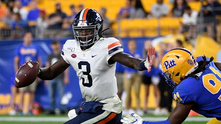 PITTSBURGH, PA – AUGUST 31: Bryce Perkins #3 of the Virginia Cavaliers stiff arms Patrick Jones II #91 of the Pittsburgh Panthers as he scrambles out of the pocket in the second half during the game at Heinz Field on August 31, 2019 in Pittsburgh, Pennsylvania. (Photo by Justin Berl/Getty Images)