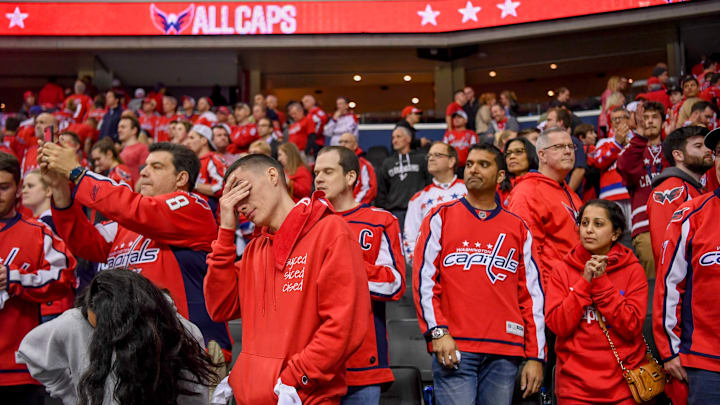 WASHINGTON, DC – APRIL 24: Washington Capitals fans react after losing to the Carolina Hurricanes in double overtime during game seven of the Stanley Cup Playoffs. (Photo by Jonathan Newton / The Washington Post via Getty Images)