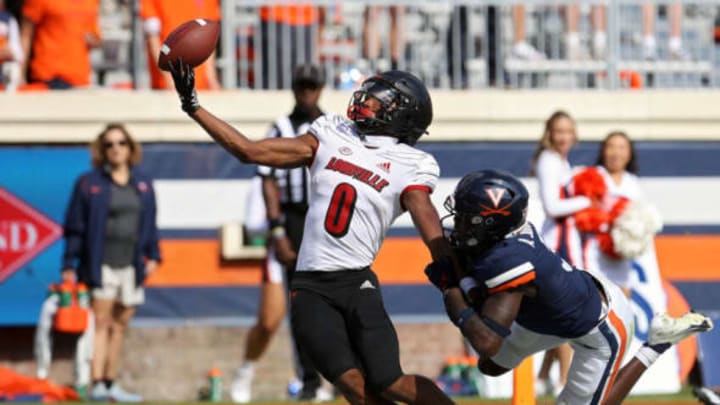 CHARLOTTESVILLE, VA – OCTOBER 08: Anthony Johnson #3 of the Virginia Cavaliers is penalized for pass interference while defending a pass intended for Tyler Hudson #0 of the Louisville Cardinals in the end zone in the second half during a game at Scott Stadium on October 8, 2022 in Charlottesville, Virginia. (Photo by Ryan M. Kelly/Getty Images)