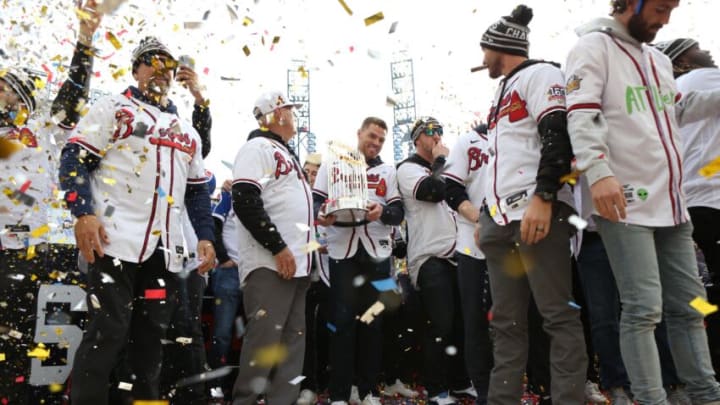 Nov 5, 2021; Atlanta, GA, USA; Atlanta Braves first baseman Freddie Freeman holds the Commissioner's Trophy during the World Series championship rally at Truist Park. Mandatory Credit: Brett Davis-USA TODAY Sports