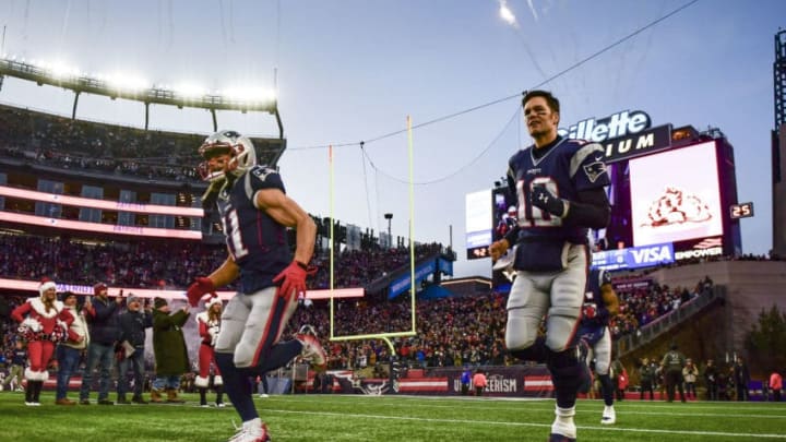 FOXBOROUGH, MA - DECEMBER 21: Julian Edelman #11 and Tom Brady #12 of the New England Patriots run onto the field before a game against the Buffalo Bills at Gillette Stadium on December 21, 2019 in Foxborough, Massachusetts. (Photo by Billie Weiss/Getty Images)