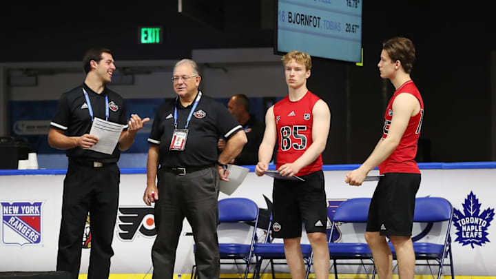 BUFFALO, NY – JUNE 1: Antti Saarela #85 and Patrik Puistola #105 await testing alongside Seth Spicer (on left) and Dan Marr, Director of NHL Scouting, during the 2019 NHL Scouting Combine on June 1, 2019 at Harborcenter in Buffalo, New York. (Photo by Bill Wippert/NHLI via Getty Images)