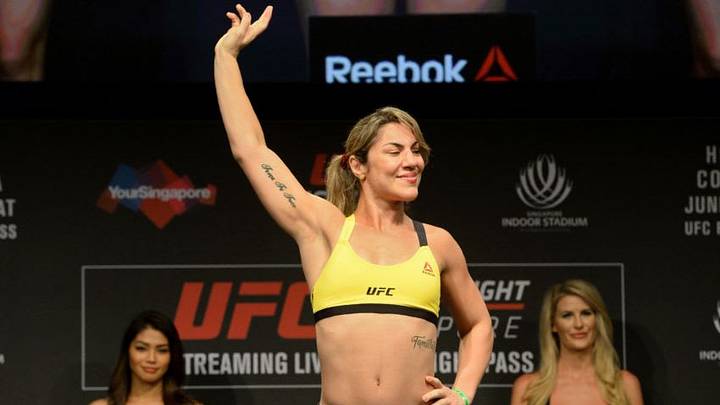 Bethe Correia of Brazil stands on the weighing scale during the UFC Fight Night official weigh-in in Singapore on June 16, 2017.Holly Holm of the US will compete against Bethe Correia of Brazil in the UFC women's bantamweight event at the UFC Fight Night in Singapore on June 17. / AFP PHOTO / Roslan RAHMAN (Photo credit should read ROSLAN RAHMAN/AFP/Getty Images)