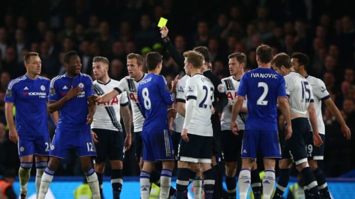 LONDON, ENGLAND - MAY 02: Referee Mark Clattenburg shows a yellow card to John Mikel Obi of Chelsea during the Barclays Premier League match between Chelsea and Tottenham Hotspur at Stamford Bridge on May 02, 2016 in London, England.jd (Photo by Ian Walton/Getty Images)