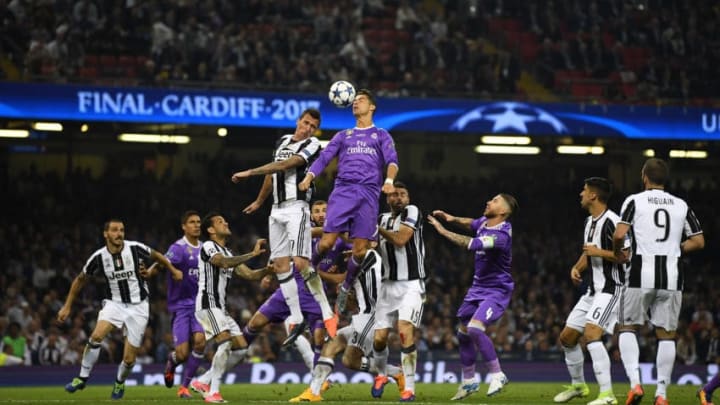 CARDIFF, WALES - JUNE 03: Mario Mandzukic of Juventus and Cristiano Ronaldo of Real Madrid battle to win a header during the UEFA Champions League Final between Juventus and Real Madrid at National Stadium of Wales on June 3, 2017 in Cardiff, Wales. (Photo by Laurence Griffiths/Getty Images)