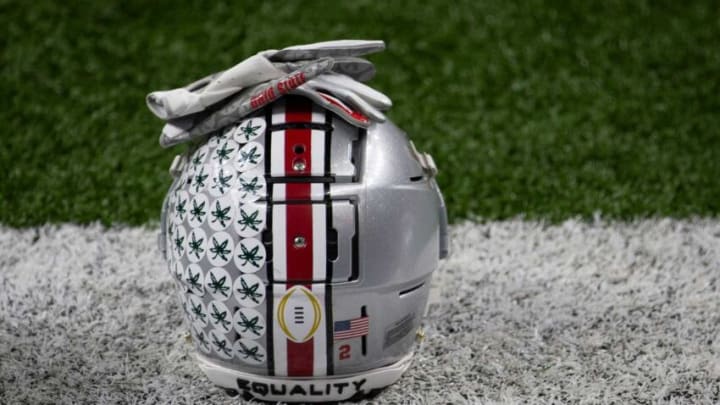 An Ohio State Buckeyes helmet sits on the sideline during warm-ups prior to the College Football Playoff semifinal against the Clemson Tigers at the Allstate Sugar Bowl in the Mercedes-Benz Superdome in New Orleans on Friday, Jan. 1, 2021.College Football Playoff Ohio State Faces Clemson In Sugar Bowl