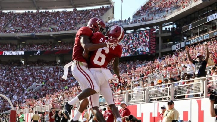 Alabama wide receiver DeVonta Smith (6) and Alabama wide receiver Jaylen Waddle (17) celebrates one of Smith's four first half touchdowns during the first half of Alabama's game with Ole Miss Saturday, Sept. 28, 2019. [Staff Photo/Gary Cosby Jr.]Alabama Vs Ole Miss