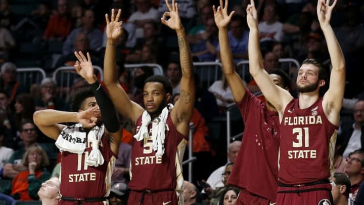 MIAMI, FLORIDA - JANUARY 27: The Florida State Seminoles bench reacts against the Miami Hurricanes during the second half at Watsco Center on January 27, 2019 in Miami, Florida. (Photo by Michael Reaves/Getty Images)