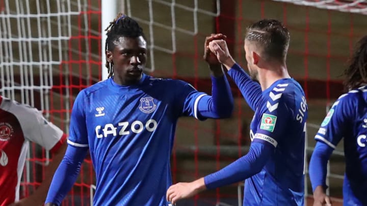 Everton's Italian midfielder Moise Kean (L) celebrates scoring his team's fifth goal during the English League Cup third round football match between Fleetwood Town and Everton at Highbury Stadium in Fleetwood, north west England, on September 23, 2020. (Photo by Alex Livesey / POOL / AFP) / RESTRICTED TO EDITORIAL USE. No use with unauthorized audio, video, data, fixture lists, club/league logos or 'live' services. Online in-match use limited to 120 images. An additional 40 images may be used in extra time. No video emulation. Social media in-match use limited to 120 images. An additional 40 images may be used in extra time. No use in betting publications, games or single club/league/player publications. / (Photo by ALEX LIVESEY/POOL/AFP via Getty Images)