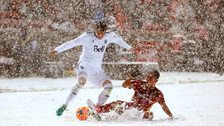 Apr 8, 2017; Sandy, UT, USA; Vancouver Whitecaps defender Jake Nerwinski (28) and Real Salt Lake midfielder Sebastian Saucedo (23) battle for the ball in the second half at Rio Tinto Stadium. Mandatory Credit: Jeff Swinger-USA TODAY Sports