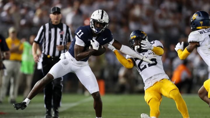 Sep 2, 2023; University Park, Pennsylvania, USA; Penn State Nittany Lions wide receiver Malik McClain (11) avoids a tackle while running with the ball during the third quarter against the West Virginia Mountaineers at Beaver Stadium. Penn State defeated West Virginia 38-15. Mandatory Credit: Matthew O’Haren-USA TODAY Sports