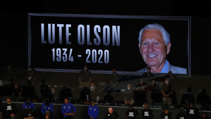 LAKE BUENA VISTA, FLORIDA - AUGUST 29: Players take a knee before the start of a game between the Milwaukee Bucks and the Orlando Magic to remember former Arizona basketball coach Lute Olson who died August 27, 2020, before the start of Game Five of the Eastern Conference First Round between the Milwaukee Bucks and the Orlando Magic during the 2020 NBA Playoffs at AdventHealth Arena at ESPN Wide World Of Sports Complex on August 29, 2020 in Lake Buena Vista, Florida. NOTE TO USER: User expressly acknowledges and agrees that, by downloading and or using this photograph, User is consenting to the terms and conditions of the Getty Images License Agreement. (Photo by Kevin C. Cox/Getty Images)