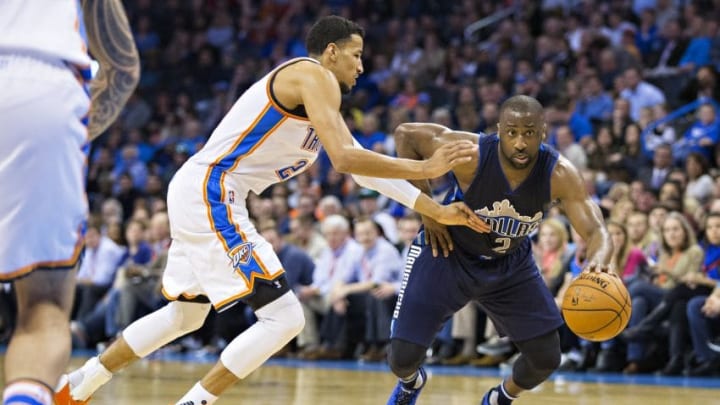 OKLAHOMA CITY, OK - JANUARY 13: Raymond Felton #2 of the Dallas Mavericks drives to the basket against Andre Roberson #21 of the Oklahoma City Thunder at Chesapeake Energy Arena on January 13, 2016 in Oklahoma City, Oklahoma. NOTE TO USER: User expressly acknowledges and agrees that, by downloading and or using this photograph, User is consenting to the terms and conditions of the Getty Images License Agreement. The Thunder defeated the Mavericks 108-89. (Photo by Wesley Hitt/Getty Images)