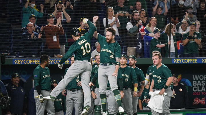Australia’s Alex Hall (L) celebrates with teammates after hitting a first inning home run during the World Baseball Classic (WBC) Sunday. (Photo by Richard A. Brooks / AFP)