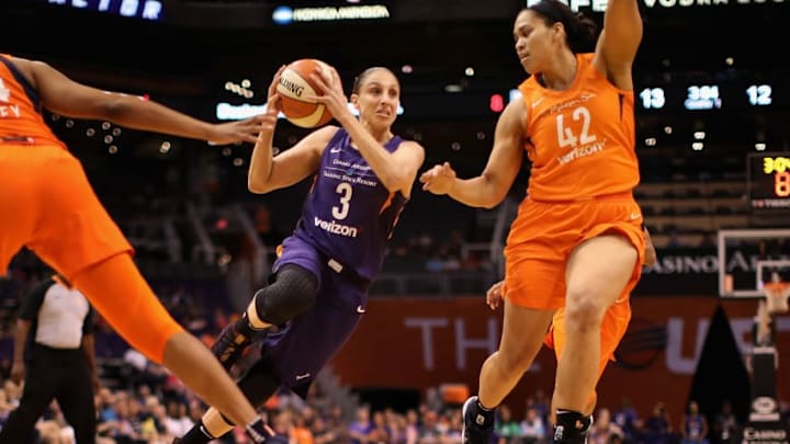 PHOENIX, AZ - JULY 05: Diana Taurasi #3 of the Phoenix Mercury drives the ball past Brionna Jones #42 of the Connecticut Sun during the first half of WNBA game at Talking Stick Resort Arena on July 5, 2018 in Phoenix, Arizona. NOTE TO USER: User expressly acknowledges and agrees that, by downloading and or using this photograph, User is consenting to the terms and conditions of the Getty Images License Agreement. (Photo by Christian Petersen/Getty Images)
