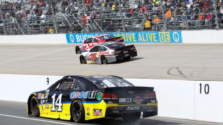 May 15, 2016; Dover, DE, USA; NASCAR Sprint Cup Series driver Tony Stewart (14) drives down pit road during the AAA 400 Drive For Autism at Dover International Speedway. Mandatory Credit: Matthew O