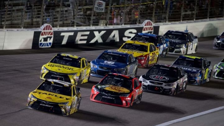 Apr 9, 2016; Fort Worth, TX, USA; Sprint Cup Series driver Carl Edwards (19) and driver Martin Truex Jr. (78) and driver Matt Kenseth (20) lead the rest of the field on a restart during the Duck Commander 500 at Texas Motor Speedway. Mandatory Credit: Jerome Miron-USA TODAY Sports