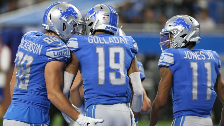 Detroit Lions wide receiver Kenny Golladay (19) receives congratulations from tight end T.J. Hockenson (88) and wide receiver Marvin Jones (11) (Photo by Scott W. Grau/Icon Sportswire via Getty Images)