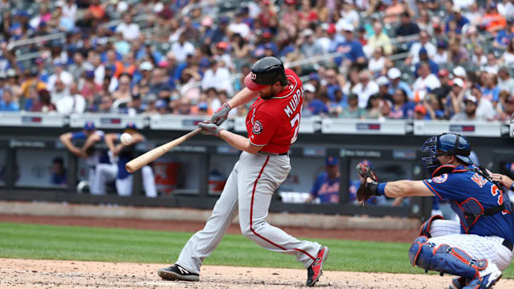 NEW YORK, NY - JULY 15: Daniel Murphy #20 of the Washington Nationals hits a two run single in the seventh inning against the New York Mets during their game at Citi Field on July 15, 2018 in New York City. (Photo by Al Bello/Getty Images)