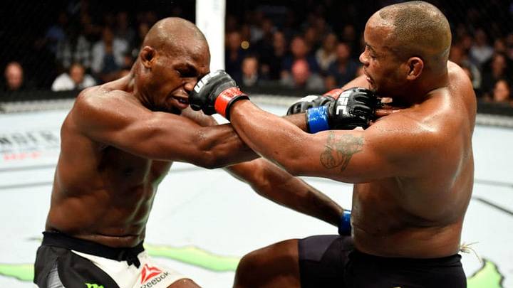 ANAHEIM, CA - JULY 29: (L-R) Jon Jones and Daniel Cormier trade strikes in their UFC light heavyweight championship bout during the UFC 214 event at Honda Center on July 29, 2017 in Anaheim, California. (Photo by Josh Hedges/Zuffa LLC/Zuffa LLC via Getty Images)