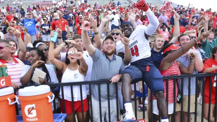 Sep 3, 2016; Starkville, MS, USA;South Alabama Jaguars defensive end Jaylan Daniels (4) celebrates with fans after the game against the Mississippi State Bulldogs at Davis Wade Stadium. South Alabama won 21-20. Mandatory Credit: Matt Bush-USA TODAY Sports