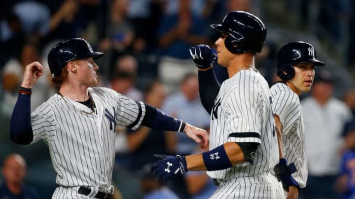 NEW YORK, NY - SEPTEMBER 14: (NEW YORK DAILIES OUT) Aaron Judge #99 of the New York Yankees celebrates his sixth inning three run home run against the Baltimore Orioles with teammates Clint Frazier #77 (L) and Jacoby Ellsbury #22 at Yankee Stadium on September 14, 2017 in the Bronx borough of New York City. The Yankees defeated the Orioles 13-5. (Photo by Jim McIsaac/Getty Images)