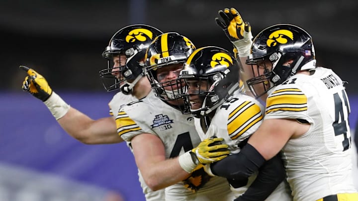 NEW YORK, NY – DECEMBER 27: Joshua Jackson #15 of the Iowa Hawkeyes celebrates with teammates after intercepting a pass from the Boston College Eagles during the second half of the New Era Pinstripe Bowl at Yankee Stadium on December 27, 2017 in the Bronx borough of New York City. The Iowa Hawkeyes won 27-20. (Photo by Adam Hunger/Getty Images)