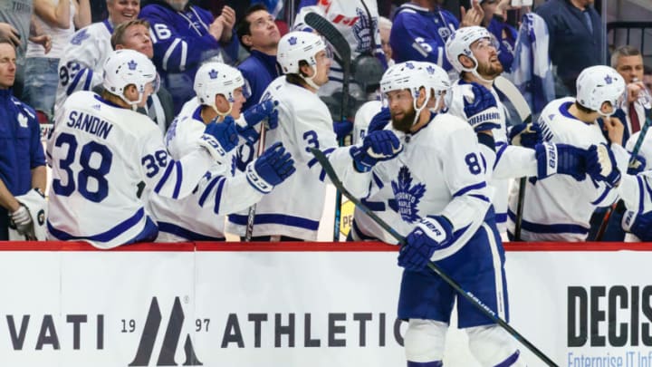 OTTAWA, ON - FEBRUARY 15: Jake Muzzin #8 of the Toronto Maple Leafs celebrates his second period goal with team mates on the bench Rasmus Sandin #38, Tyson Barrie #94 and Justin Holl #3 at Canadian Tire Centre on February 15, 2020 in Ottawa, Ontario, Canada. (Photo by Jana Chytilova/Freestyle Photography/Getty Images)