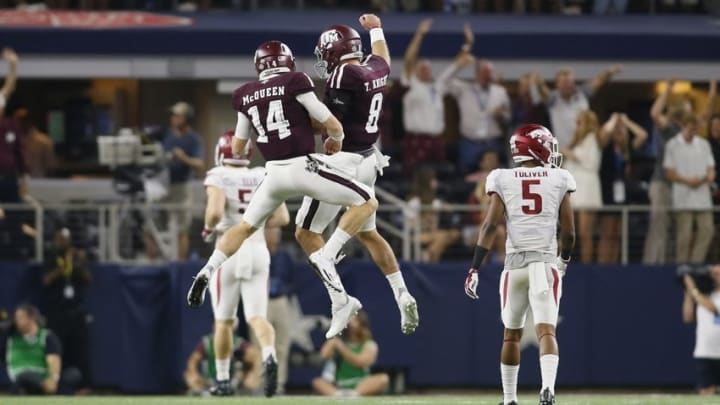 Sep 24, 2016; Dallas, TX, USA; Texas A&M Aggies quarterback Trevor Knight (8) and Texas A&M Aggies quarterback Conner McQueen (14) celebrate a touchdown while Arkansas Razorbacks defensive back Henre