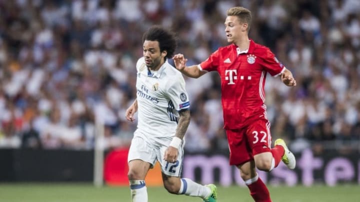 MADRID, SPAIN - APRIL 18: Marcelo Vieira Da Silva of Real Madrid is followed by Joshua Kimmich of FC Bayern Munich during their 2016-17 UEFA Champions League Quarter-finals second leg match between Real Madrid and FC Bayern Munich at the Estadio Santiago Bernabeu on 18 April 2017 in Madrid, Spain. (Photo by Power Sport Images/Getty Images)