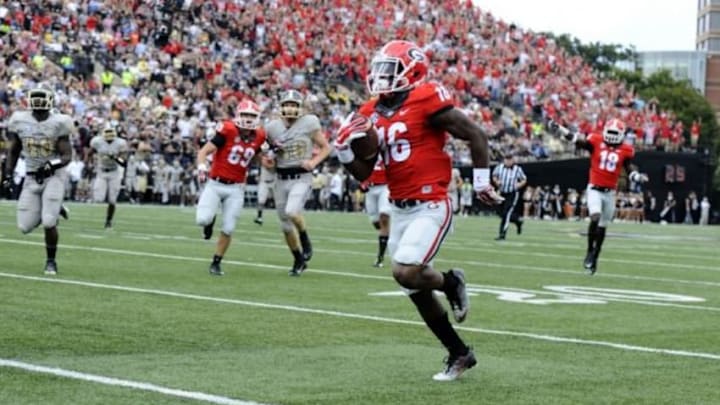 Sep 12, 2015; Nashville, TN, USA; Georgia Bulldogs receiver Isaiah McKenzie (16) returns a punt for a touchdown during the first half against the Vanderbilt Commodores at Vanderbilt Stadium. Mandatory Credit: Christopher Hanewinckel-USA TODAY Sports