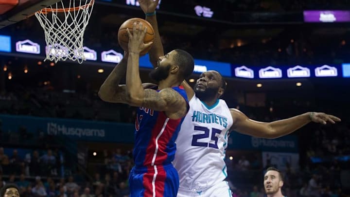 Mar 11, 2016; Charlotte, NC, USA; Detroit Pistons forward Marcus Morris (13) goes up for a shot against Charlotte Hornets center Al Jeffereson (25) in the first half at Time Warner Cable Arena. Mandatory Credit: Jeremy Brevard-USA TODAY Sports
