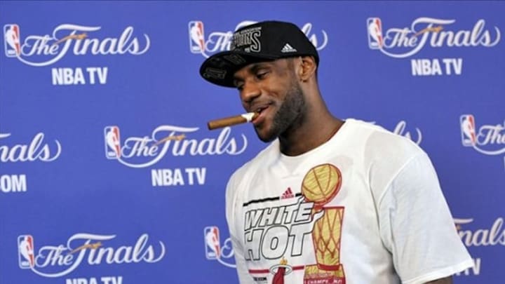 Jun 20, 2013; Miami, FL, USA; Miami Heat small forward LeBron James exits a press conference after defeating the San Antonio Spurs in game seven in the 2013 NBA Finals at American Airlines Arena. Miami Heat won 95-88 to win the NBA Championship. Mandatory Credit: Steve Mitchell-USA TODAY Sports