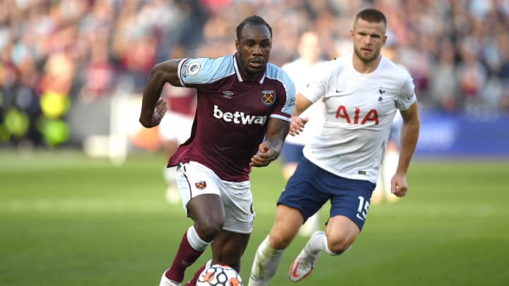LONDON, ENGLAND – OCTOBER 24: Michail Antonio of West Ham United runs with the ball under pressure from Eric Dier of Tottenham Hotspur during the Premier League match between West Ham United and Tottenham Hotspur at London Stadium on October 24, 2021 in London, England. (Photo by Harriet Lander/Copa/Getty Images)