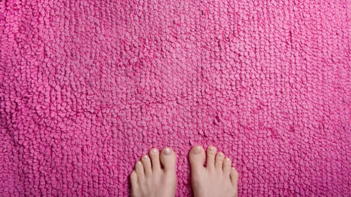 Feet on a pink rug