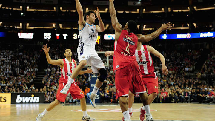 LONDON, ENGLAND - MAY 12: Rudy Fernandez of Real Madrid tussles with Kyle Hines of Olympiacos Piraeus during the Turkish Airlines EuroLeague Final Four final between Olympiacos Piraeus and Real Madrid at the O2 Arena on May 12, 2013 in London, England. (Photo by Jamie McDonald/Getty Images)